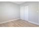 Bedroom with modern flooring and a closet, offering a bright and airy space at 1085 Whitewood Dr, Deltona, FL 32725