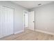 Bedroom offers fresh paint, modern flooring, and a closet providing ample storage at 1085 Whitewood Dr, Deltona, FL 32725