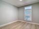 Bedroom with light wood floors and a window at 1085 Whitewood Dr, Deltona, FL 32725