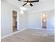 Bright bedroom with light wood floors, ceiling fan and ensuite bathroom at 1085 Whitewood Dr, Deltona, FL 32725