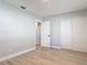 Bright bedroom features fresh paint, modern flooring, and ample closet space at 1085 Whitewood Dr, Deltona, FL 32725