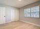 Bedroom has light wood floors, a double closet and a window at 1085 Whitewood Dr, Deltona, FL 32725