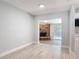 Open living space showcases brick fireplace, new flooring, and natural light from sliding glass doors, perfect for relaxation at 1085 Whitewood Dr, Deltona, FL 32725