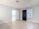 Inviting living room features new gray vinyl floors, fresh paint, leading to other rooms in the home at 1085 Whitewood Dr, Deltona, FL 32725