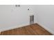 Interior laundry room features wood-look flooring and white walls at 1114 Olivine Ave, Dundee, FL 33838