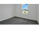 Bedroom with a single window offers natural light and exterior views at 1118 Olivine Ave, Dundee, FL 33838