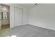Carpeted bedroom with a closet and an ensuite bathroom featuring a sink and vanity at 1118 Olivine Ave, Dundee, FL 33838