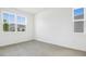 Bright bedroom featuring tile floors, a large window, and ample natural light at 1130 Olivine Ave, Dundee, FL 33838