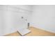 Simple laundry room with tile floors, hookups, and wire shelving at 1130 Olivine Ave, Dundee, FL 33838