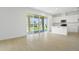 Spacious living area featuring tile floors and sliding glass doors leading to the outdoors at 1130 Olivine Ave, Dundee, FL 33838