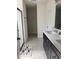 Modern bathroom features double sinks, quartz countertops and a spacious walk-in closet at 12 E Murphy E St, Davenport, FL 33837