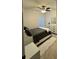 Cozy bedroom with ceiling fan and ample natural light from the large window at 12 E Murphy E St, Davenport, FL 33837