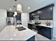 Stylish kitchen showcasing a marble island, stainless steel appliances, and pendant lighting at 12 E Murphy E St, Davenport, FL 33837