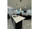 Open-concept kitchen flows into the living area, perfect for entertaining guests at 12 E Murphy E St, Davenport, FL 33837