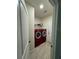 Well-equipped laundry room featuring modern appliances, storage, and stylish tile floors at 12 E Murphy E St, Davenport, FL 33837