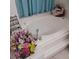 Elegant soaking tub decorated with fresh flowers, creating a spa-like retreat at 12966 Broakfield Cir, Orlando, FL 32837