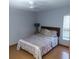 Bedroom with a bed, hardwood floors, a window with blinds, and neutral colors for a calming atmosphere at 12966 Broakfield Cir, Orlando, FL 32837