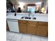 Open kitchen design with a double stainless steel sink and modern faucet at 12966 Broakfield Cir, Orlando, FL 32837