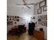 Office space with high ceilings, ceiling fan, wood laminate floors, and natural light from a large window at 12966 Broakfield Cir, Orlando, FL 32837