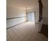 Dining room with tile floor and sliding glass door to backyard at 1304 Mill Creek Pl, Kissimmee, FL 34744