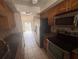 Traditional kitchen showcases stainless steel appliances and granite countertops at 1304 Mill Creek Pl, Kissimmee, FL 34744