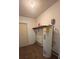Utility room with wood floor and shelving at 1304 Mill Creek Pl, Kissimmee, FL 34744