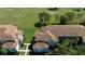 An aerial view of the residential buildings showcasing the tile roofing and manicured lawns at 14049 Fairway Island Dr # 122, Orlando, FL 32837