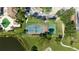 Aerial view of the tennis and basketball court and other amenities of the condo community at 14049 Fairway Island Dr # 122, Orlando, FL 32837