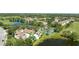 Aerial view showcasing the condo community amenities and the surrounding golf course and pond at 14049 Fairway Island Dr # 122, Orlando, FL 32837