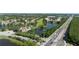 Aerial view of a community with lush green landscaping, lakes, and golf course for outdoor enjoyment at 14049 Fairway Island Dr # 122, Orlando, FL 32837