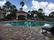 Community pool showcasing clear water, lounge chairs, and covered cabana areas for a relaxed outdoor experience at 14049 Fairway Island Dr # 122, Orlando, FL 32837