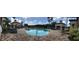 A serene community pool featuring comfortable lounge chairs, cabanas, and a well-maintained brick deck, ideal for relaxation and recreation at 14049 Fairway Island Dr # 122, Orlando, FL 32837
