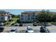 Beautiful two-story condo building featuring ample parking, well-maintained landscaping, and neutral stucco siding at 14049 Fairway Island Dr # 122, Orlando, FL 32837