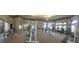 Well-equipped fitness center featuring various exercise machines, free weights, mirrored walls, and ample workout space at 14049 Fairway Island Dr # 122, Orlando, FL 32837