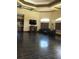 Spacious living room with beautiful tile floors, fireplace, and views into an open kitchen at 14049 Fairway Island Dr # 122, Orlando, FL 32837