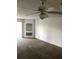 Neutral living room with a carpeted floor, niche shelving, and a ceiling fan with lighting at 14049 Fairway Island Dr # 122, Orlando, FL 32837