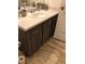 Bathroom vanity with decorative sink, faucet, and wood look cabinets at 14049 Fairway Island Dr # 127, Orlando, FL 32837