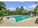 Refreshing pool with plenty of space for swimming and lounging, complemented by lush landscaping and a pergola at 1589 Resolute St, Celebration, FL 34747