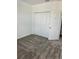 Comfortable bedroom featuring neutral walls, plush carpeting, and a closet at 2414 Skyline Loop, Kissimmee, FL 34758
