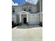 Modern townhouse exterior features a front-entry garage, neutral stucco and stone accents at 2414 Skyline Loop, Kissimmee, FL 34758
