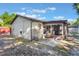 Backyard view showing a screened patio, providing an enjoyable indoor/outdoor space and extra seating at 2429 Oak Run Blvd, Kissimmee, FL 34744