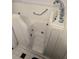 Accessible walk-in bathtub with safety grab bar and modern chrome faucet at 2429 Oak Run Blvd, Kissimmee, FL 34744