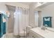 Bathroom with combined tub and shower, vanity, and modern fixtures at 2429 Oak Run Blvd, Kissimmee, FL 34744