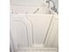 Image of a walk-in bathtub with chrome fixtures and white tiles at 2429 Oak Run Blvd, Kissimmee, FL 34744