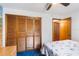 Cozy bedroom featuring a ceiling fan, closet, and doorway at 2429 Oak Run Blvd, Kissimmee, FL 34744