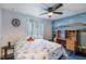 Bright bedroom with a ceiling fan, modern decorations, and lots of natural light at 2429 Oak Run Blvd, Kissimmee, FL 34744