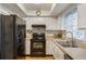 Well-lit kitchen features a suite of essential appliances, practical countertop space at 2429 Oak Run Blvd, Kissimmee, FL 34744