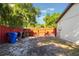 Exterior side yard featuring a private fence and a shed, providing space and storage at 2429 Oak Run Blvd, Kissimmee, FL 34744