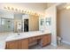 Large primary bathroom featuring a double vanity, tile flooring, walk in shower and walk in closet at 2706 Sebastian Ct, Kissimmee, FL 34743