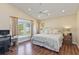 Bedroom with bay windows, wood floors and plenty of natural light for a relaxing space at 2706 Sebastian Ct, Kissimmee, FL 34743